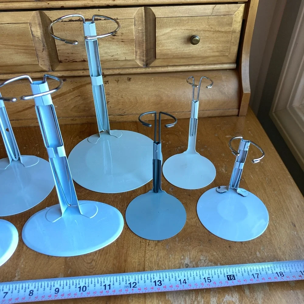 7 doll holders or White and Gray Jewelry Stands